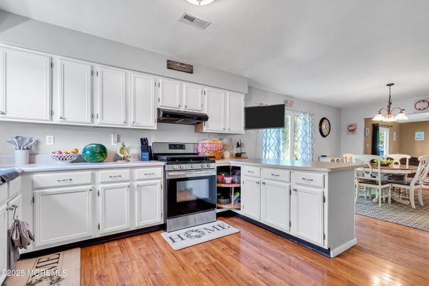 Dining room, Interior, Kitchen, Pendant Lights, Stainless Steel Appliances, Wood Texture Flooring