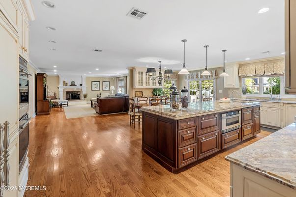 Dining room, Fireplace, Interior, Kitchen, Living room, Pendant Lights, Recessed Lighting, Wood Texture Flooring