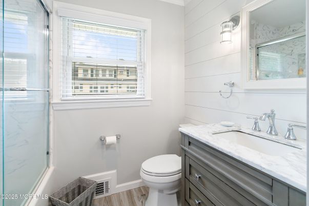 Bathroom, Glass Shower, Interior, Marble Walls, Wood Texture Flooring