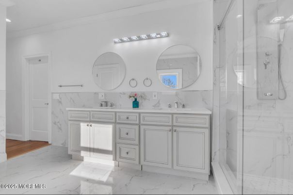 Bathroom, Dual Sink Vanities, Glass Shower, Interior, Marble, Marble Walls, Recessed Lighting