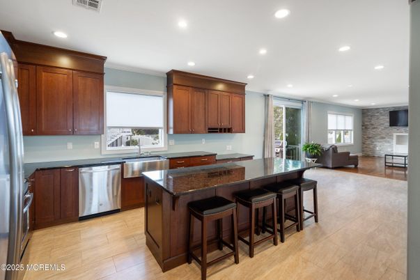 Interior, Kitchen, Recessed Lighting, Stainless Steel Appliances, Stone Walls, Wood Texture Flooring