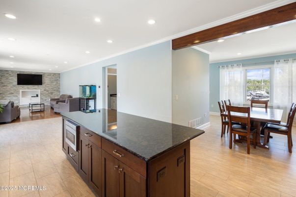 Dining room, Fireplace, Interior, Kitchen, Living room, Recessed Lighting, Stone Walls, Wooden Beams, Wood Texture Flooring