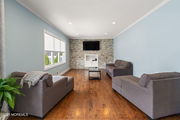 Fireplace, Interior, Living room, Recessed Lighting, Stone Walls, Wood Texture Flooring