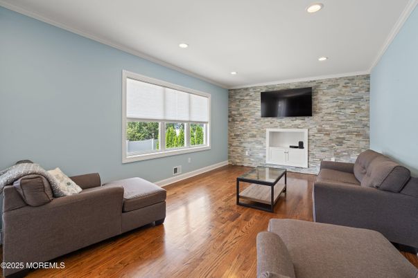 Fireplace, Interior, Living room, Recessed Lighting, Stone Walls, Wood Texture Flooring
