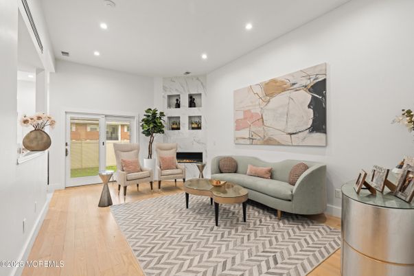Fireplace, Interior, Living room, Marble Walls, Recessed Lighting, Wood Texture Flooring