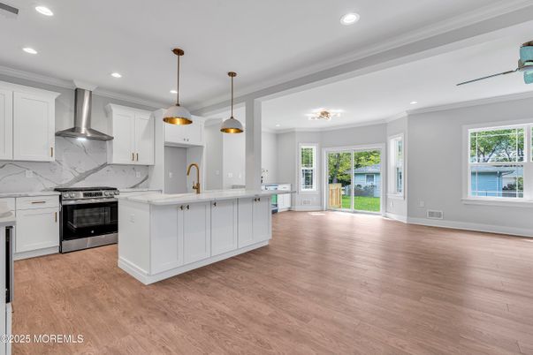 Interior, Kitchen, Marble Walls, Pendant Lights, Recessed Lighting, Stainless Steel Appliances, Wood Texture Flooring