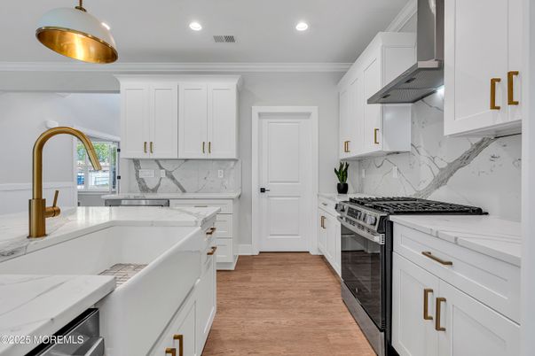 Interior, Kitchen, Marble Walls, Recessed Lighting, Stainless Steel Appliances, Wood Texture Flooring