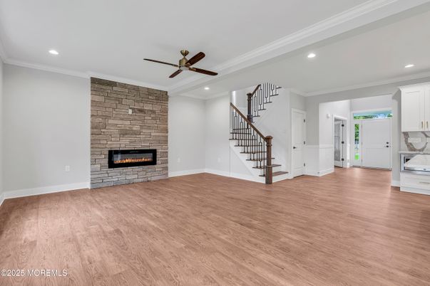 Empty room, Fireplace, Interior, Recessed Lighting, Stone Walls, Wood Texture Flooring