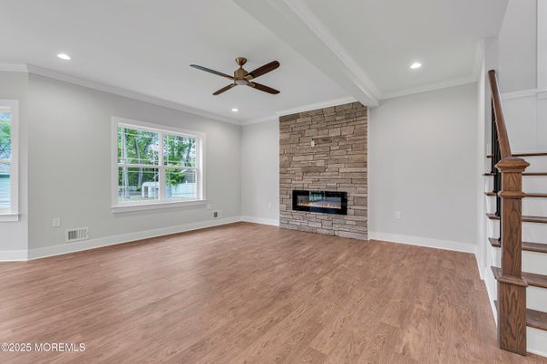 Empty room, Fireplace, Interior, Recessed Lighting, Stone Walls, Wood Texture Flooring