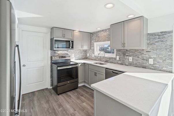 Interior, Kitchen, Recessed Lighting, Stainless Steel Appliances, Wood Texture Flooring
