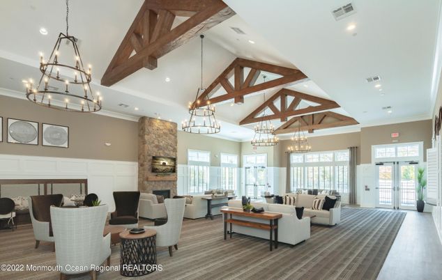 Chandelier, Dining room, Fireplace, Interior, Living room, Pendant Lights, Recessed Lighting, Wooden Beams, Wood Texture Flooring