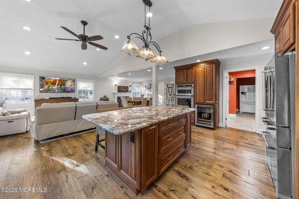 Chandelier, Dining room, Interior, Kitchen, Living room, Recessed Lighting, Stainless Steel Appliances, Wood Texture Flooring