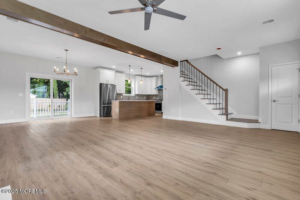 Chandelier, Empty room, Interior, Kitchen, Pendant Lights, Recessed Lighting, Stainless Steel Appliances, Wood Texture Flooring
