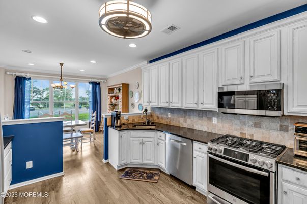 Dining room, Interior, Kitchen, Pendant Lights, Recessed Lighting, Stainless Steel Appliances, Wood Texture Flooring
