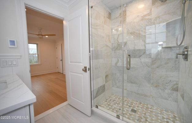 Bathroom, Glass Shower, Interior, Marble Walls, Recessed Lighting, Wood Texture Flooring