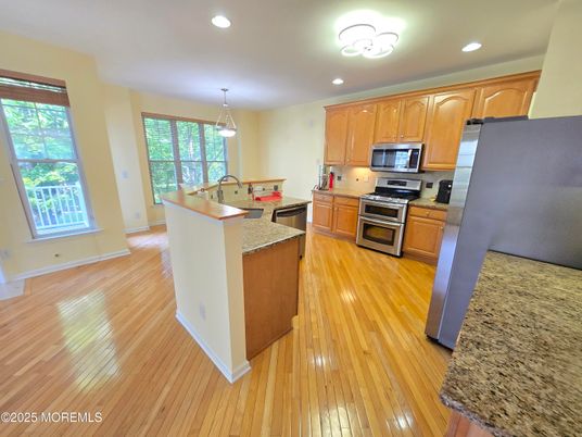 Dining room, Interior, Kitchen, Pendant Lights, Recessed Lighting, Stainless Steel Appliances, Wood Texture Flooring