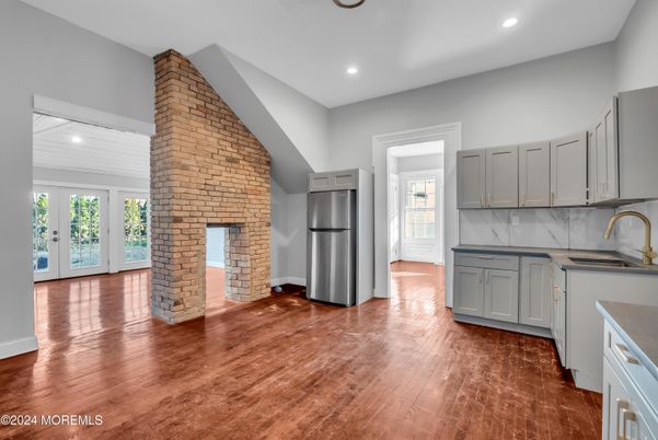 Fireplace, Interior, Kitchen, Recessed Lighting, Stone Walls, Wood Texture Flooring