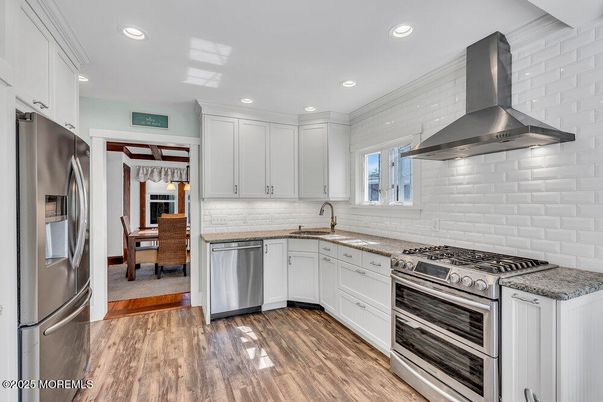 Dining room, Interior, Kitchen, Recessed Lighting, Stainless Steel Appliances, Wood Texture Flooring