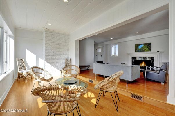 Fireplace, Interior, Living room, Recessed Lighting, Stone Walls, Wood Texture Flooring