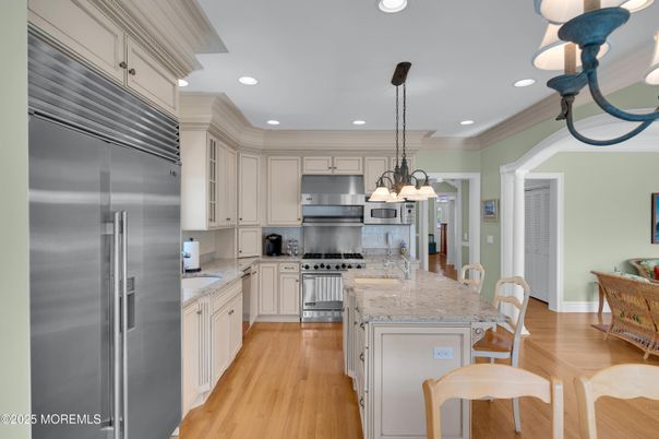 Chandelier, Interior, Kitchen, Pendant Lights, Recessed Lighting, Stainless Steel Appliances, Wood Texture Flooring
