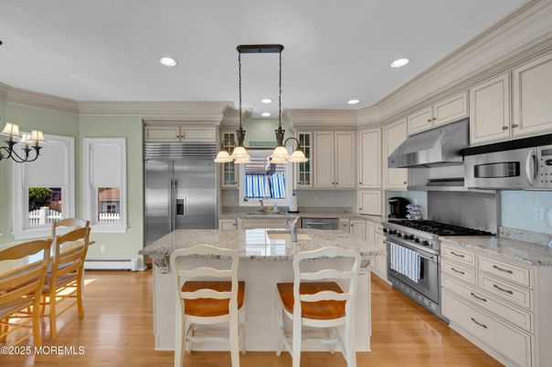 Chandelier, Interior, Kitchen, Pendant Lights, Recessed Lighting, Stainless Steel Appliances, Wood Texture Flooring