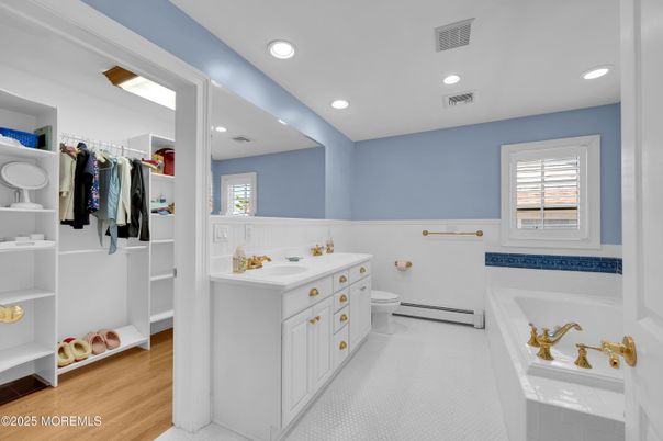 Bathroom, Dual Sink Vanities, Interior, Recessed Lighting, Walk-in Closets, Wood Texture Flooring