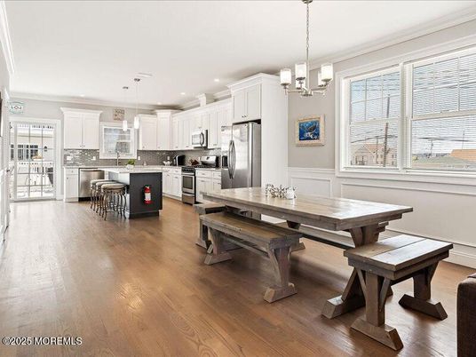 Dining room, Interior, Kitchen, Pendant Lights, Recessed Lighting, Stainless Steel Appliances, Wood Texture Flooring
