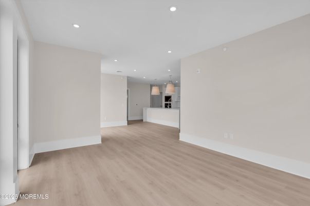 Empty room, Interior, Kitchen, Pendant Lights, Recessed Lighting, Stainless Steel Appliances, Wood Texture Flooring