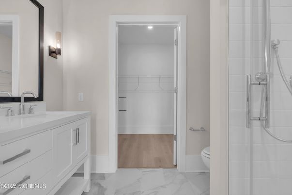 Bathroom, Dual Sink Vanities, Interior, Marble, Recessed Lighting, Walk-in Closets, Wood Texture Flooring