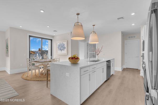 Dining room, Interior, Kitchen, Pendant Lights, Recessed Lighting, Stainless Steel Appliances, Wood Texture Flooring