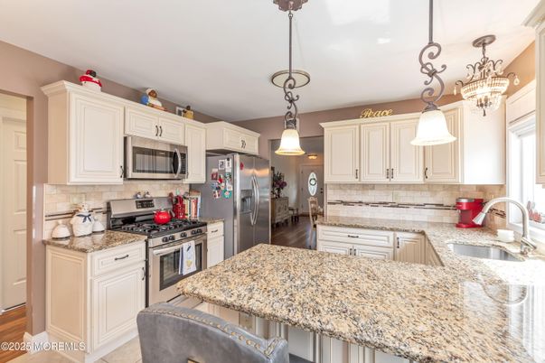 Chandelier, Interior, Kitchen, Pendant Lights, Stainless Steel Appliances, Wood Texture Flooring