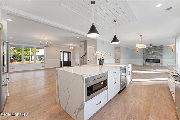 Fireplace, Interior, Kitchen, Pendant Lights, Recessed Lighting, Stainless Steel Appliances, Wood Texture Flooring