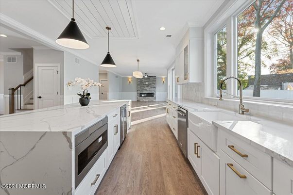 Fireplace, Interior, Kitchen, Pendant Lights, Recessed Lighting, Stainless Steel Appliances, Wood Texture Flooring