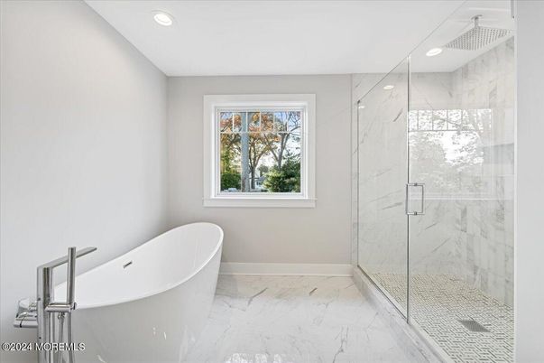 Bathroom, Free Standing Baths, Glass Shower, Interior, Marble, Marble Walls, Recessed Lighting