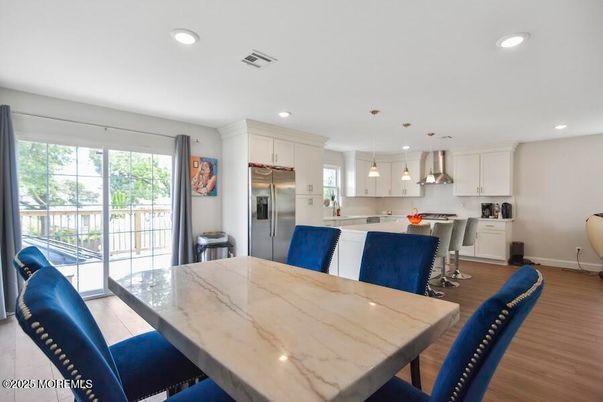Dining room, Interior, Kitchen, Pendant Lights, Recessed Lighting, Stainless Steel Appliances, Wood Texture Flooring