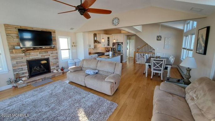 Dining room, Fireplace, Interior, Kitchen, Living room, Pendant Lights, Stone Walls, Wood Texture Flooring