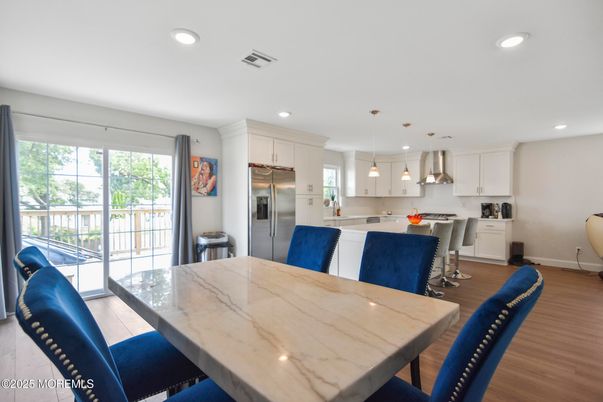 Dining room, Interior, Kitchen, Pendant Lights, Recessed Lighting, Stainless Steel Appliances, Wood Texture Flooring