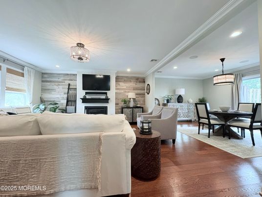 Dining room, Fireplace, Interior, Living room, Pendant Lights, Recessed Lighting, Wood Texture Flooring, Wooden Walls
