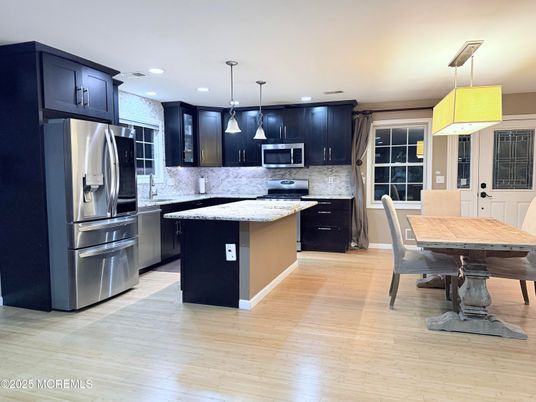 Dining room, Interior, Kitchen, Pendant Lights, Recessed Lighting, Stainless Steel Appliances, Wood Texture Flooring