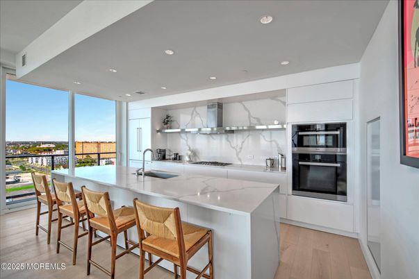 Interior, Kitchen, Marble Walls, Recessed Lighting, Stainless Steel Appliances, Water, Wood Texture Flooring
