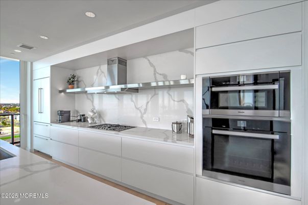 Interior, Kitchen, Marble Walls, Recessed Lighting, Stainless Steel Appliances