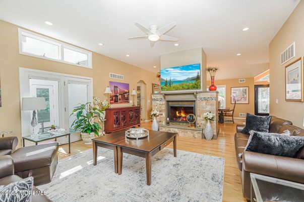 Dining room, Fireplace, Interior, Living room, Recessed Lighting, Wood Texture Flooring