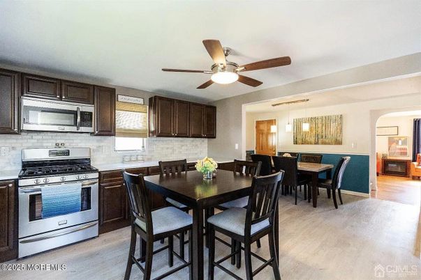 Dining room, Interior, Kitchen, Pendant Lights, Stainless Steel Appliances, Wood Texture Flooring