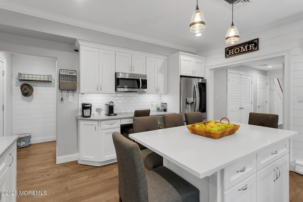 Dining room, Interior, Kitchen, Pendant Lights, Recessed Lighting, Stainless Steel Appliances, Wood Texture Flooring