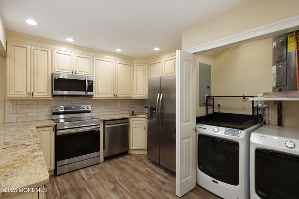 Interior, Kitchen, Recessed Lighting, Stainless Steel Appliances, Washer, Wood Texture Flooring