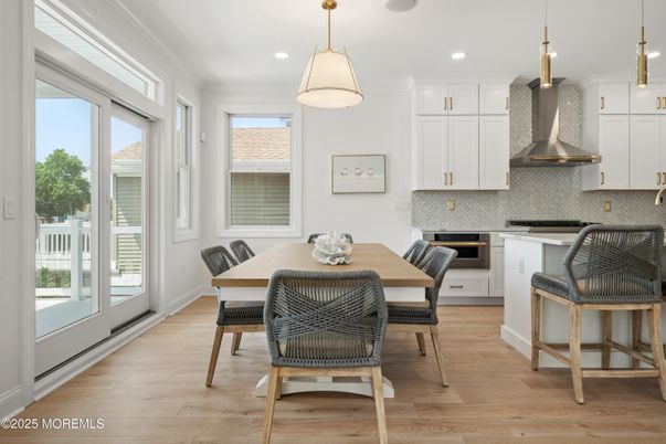 Dining room, Interior, Kitchen, Pendant Lights, Recessed Lighting, Stainless Steel Appliances, Wood Texture Flooring