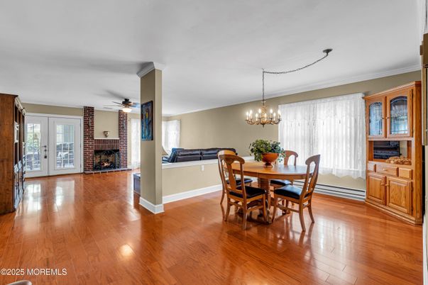 Chandelier, Dining room, Fireplace, Interior, Wood Texture Flooring