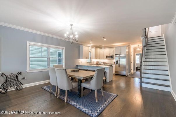 Chandelier, Dining room, Interior, Kitchen, Pendant Lights, Recessed Lighting, Stainless Steel Appliances, Wood Texture Flooring