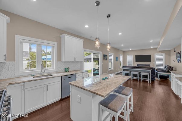 Dining room, Interior, Kitchen, Living room, Pendant Lights, Recessed Lighting, Stainless Steel Appliances, Wood Texture Flooring
