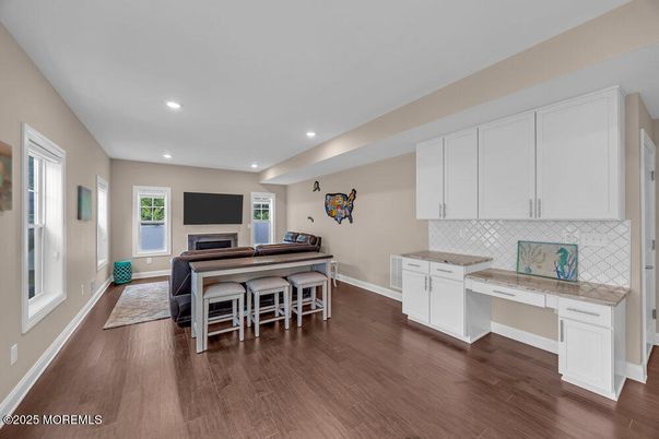 Fireplace, Interior, Kitchen, Recessed Lighting, Tile Countertops, Wood Texture Flooring
